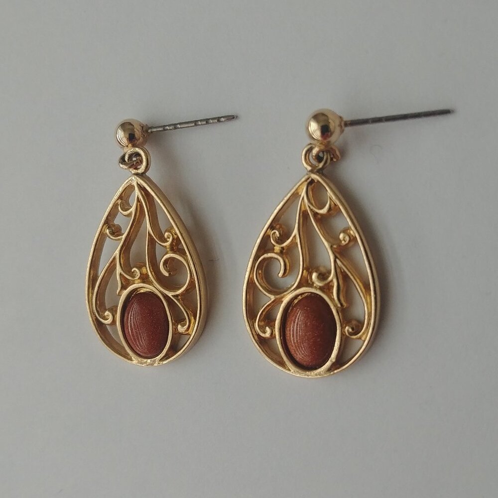 4/$20 Gold tone dangle earrings with orange shimmer accent